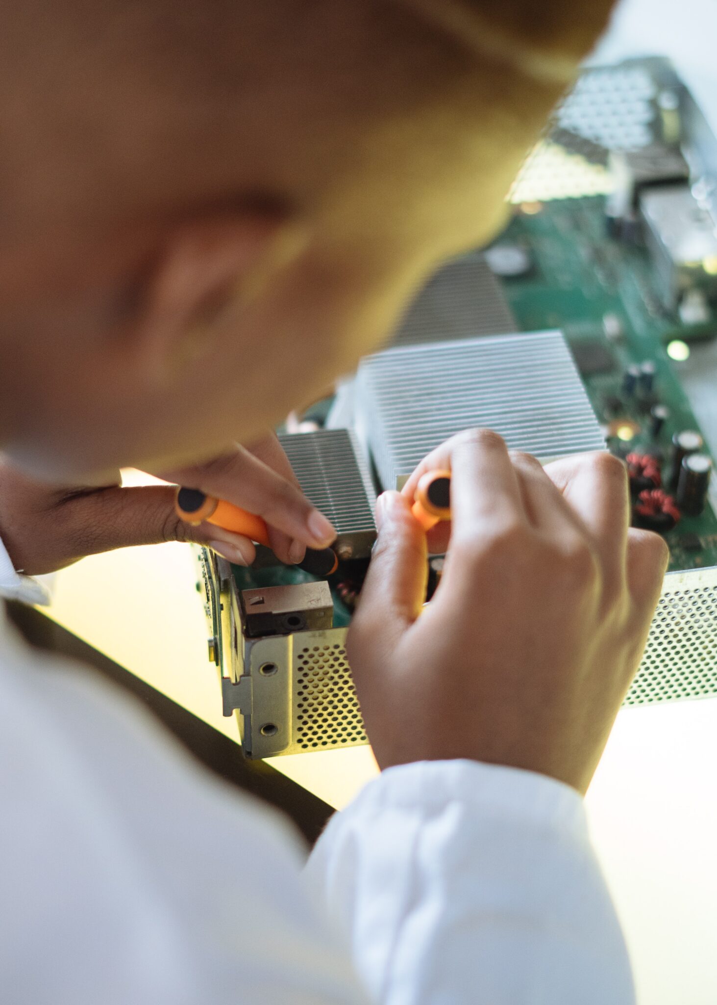 A person working on an electronic device.